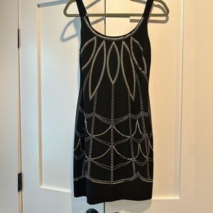 Short black dress with metal beading